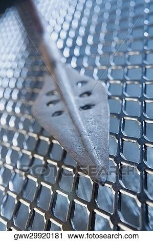 Close-up of a spear on a grille View Large Photo Image Stock Image - Close-up of a spear on a grille. Fotosearch