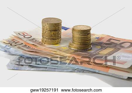 Close-up of a stack of Euro dollars and gold coins View Large Photo Image Stock Image - Close-up of a stack of Euro dollars and gold coins. Fotosearch
