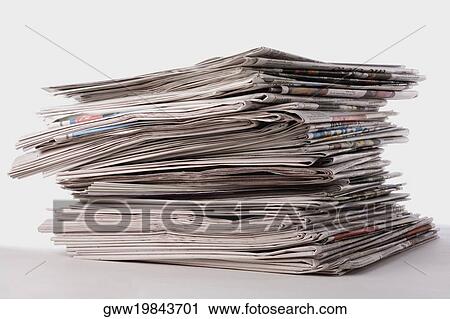 Stock Image - Close-up of a stack of newspapers. Fotosearch