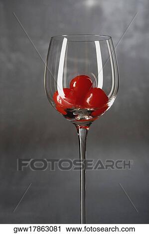 Close-up of a stem glass with a cherry View Large Photo Image Stock Image - Close-up of a stem glass with a cherry. Fotosearch