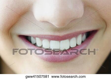Stock Image - Close-up of a teenage girl smiling. Fotosearch
