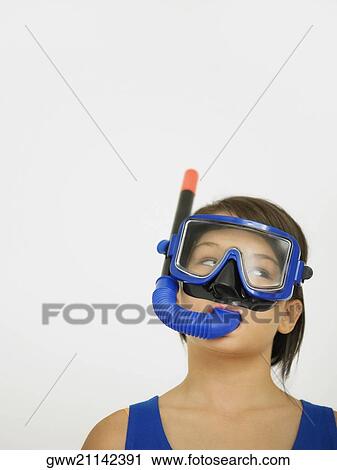 Close-up of a teenage girl with a snorkel on her face View Large Photo Image Stock Image - Close-up of a teenage girl with a snorkel on her face. Fotosearch