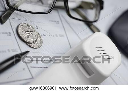 Close-up of a telephone receiver with coins and a pair of eyeglasses on a check View Large Photo Image Stock Image - Close-up of a telephone receiver with coins and a pair of eyeglasses on a check. Fotosearch