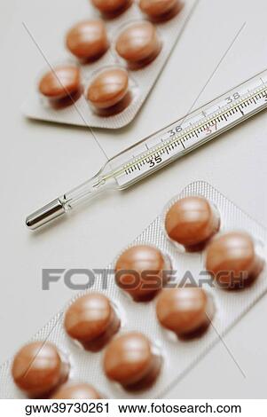 Close-up of a thermometer with two blister packs View Large Photo Image Stock Image - Close-up of a thermometer with two blister packs. Fotosearch