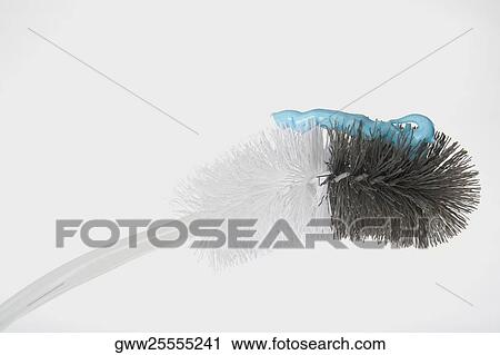 Stock Image - Close-up of a toilet brush with gel. Fotosearch