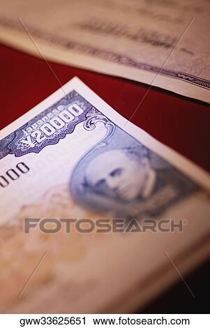 Stock Image - Close-up of a twenty thousand Japanese yen note. Fotosearch