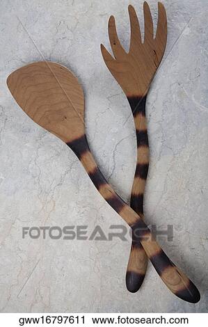 Stock Image - Close-up of a wooden fork and a spoon. Fotosearch