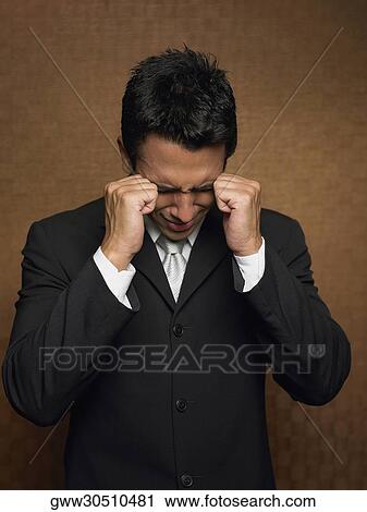 Close-up of a young man distraught with his hands View Large Photo Image Stock Image - Close-up of a young man distraught with his hands. Fotosearch