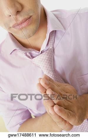 Close-up of a young man praying View Large Photo Image Stock Image - Close-up of a young man praying. Fotosearch