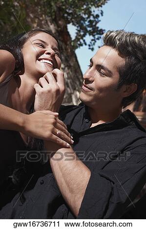 Close-up of a young man touching a teenage girl's chin, Cartagena, Colombia View Large Photo Image Stock Image - Close-up of a young man touching a teenage girl's chin, Cartagena, Colombia. Fotosearch