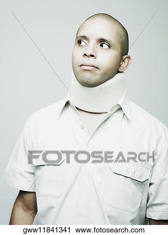 Close-up of a young man wearing a neck brace View Large Photo Image Stock Image - Close-up of a young man wearing a neck brace. Fotosearch