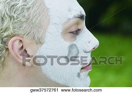 Close-up of a young man wearing a facial mask View Large Photo Image Stock Image - Close-up of a young man wearing a facial mask. Fotosearch
