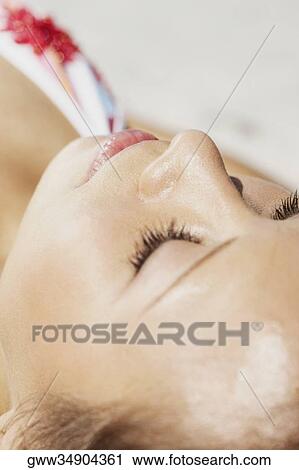 Close-up of a young woman sleeping View Large Photo Image Stock Image - Close-up of a young woman sleeping. Fotosearch