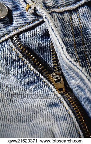 Close-up of a zipper on a pair of jeans View Large Photo Image Stock Image - Close-up of a zipper on a pair of jeans. Fotosearch