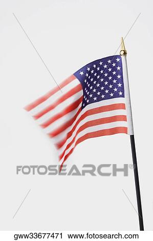 Stock Image - Close-up of an American flag fluttering. Fotosearch