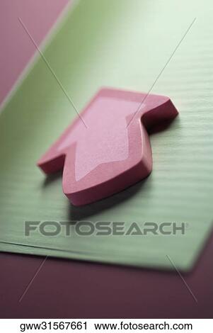 Close-up of an arrow shaped paperweight View Large Photo Image Stock Image - Close-up of an arrow shaped paperweight. Fotosearch