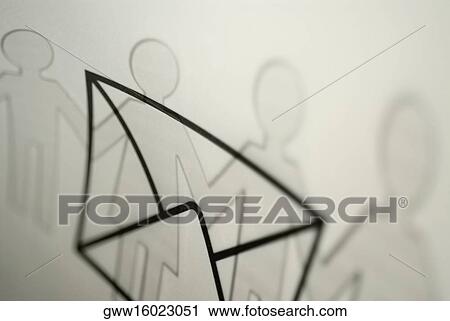 Close-up of an envelope over paper chain dolls View Large Photo Image Stock Image - Close-up of an envelope over paper chain dolls. Fotosearch