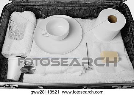 Stock Image - Close-up of an open suitcase. Fotosearch