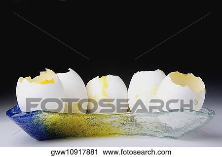 Close-up of broken eggs in a tray View Large Photo Image Stock Image - Close-up of broken eggs in a tray. Fotosearch