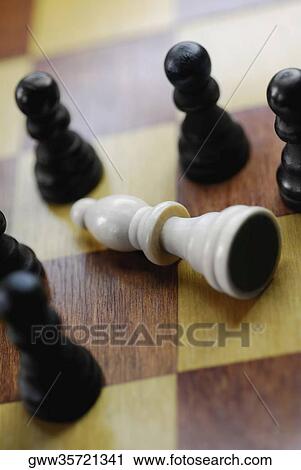 Close-up of chess pieces on a chess board View Large Photo Image Stock Image - Close-up of chess pieces on a chess board. Fotosearch