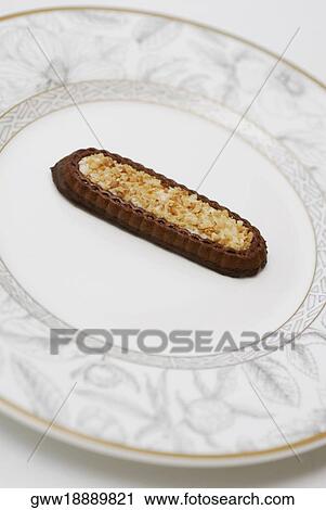 Close-up of chocolate cookie with nuts in a plate View Large Photo Image Stock Image - Close-up of chocolate cookie with nuts in a plate. Fotosearch