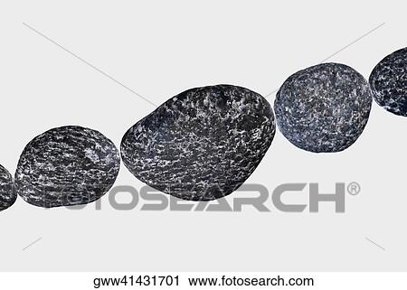 Stock Image - Close-up of five pebbles in a row. Fotosearch