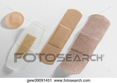 Close-up of four adhesive bandages View Large Photo Image Stock Image - Close-up of four adhesive bandages. Fotosearch