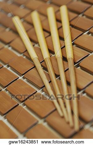 Stock Image - Close-up of four chopsticks. Fotosearch