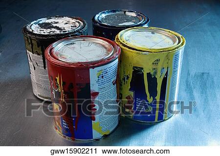 Stock Image - Close-up of four paint cans. Fotosearch