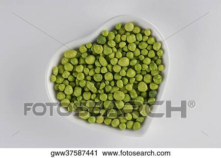 Close-up of green pebble in a heart shape bowl View Large Photo Image Stock Image - Close-up of green pebble in a heart shape bowl. Fotosearch