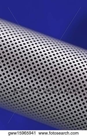 Stock Image - Close-up of holes on a metal cylinder. Fotosearch