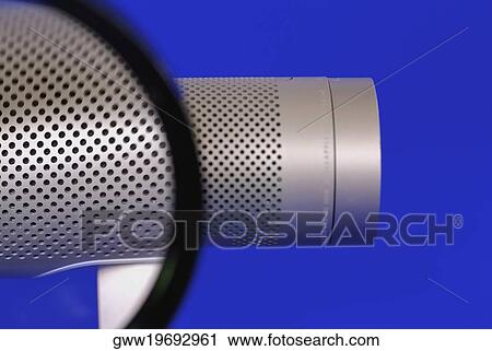 Close-up of holes on a metal cylinder seen through a magnifying glass View Large Photo Image Stock Image - Close-up of holes on a metal cylinder seen through a magnifying glass. Fotosearch
