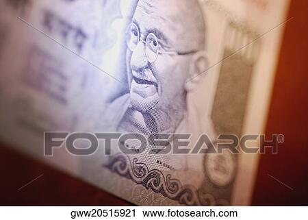 Stock Image - Close-up of Mahatma Gandhi on a one hundred rupee note. Fotosearch