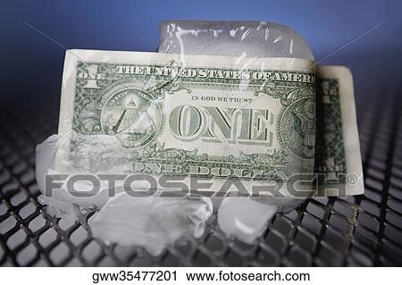 Close-up of one dollar bill wrapped around an ice cube View Large Photo Image Stock Image - Close-up of one dollar bill wrapped around an ice cube. Fotosearch