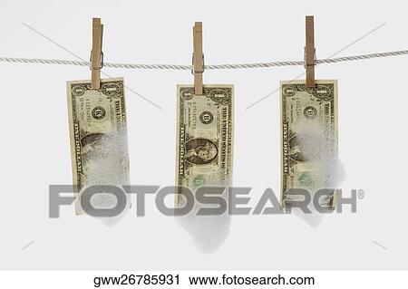 Close-up of one dollar bills hanging with clothespins View Large Photo Image Stock Image - Close-up of one dollar bills hanging with clothespins. Fotosearch