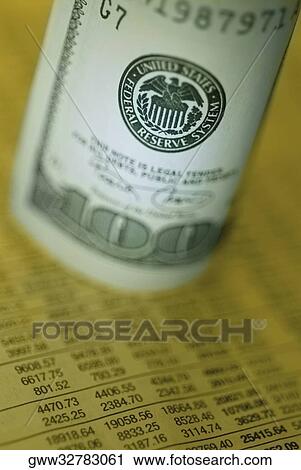 Close-up of one hundred dollar bill on a financial page View Large Photo Image Stock Image - Close-up of one hundred dollar bill on a financial page. Fotosearch