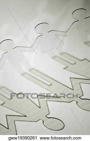 Stock Image - Close-up of paper chain dolls. Fotosearch