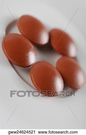 Close-up of pills on a plate View Large Photo Image Stock Image - Close-up of pills on a plate. Fotosearch