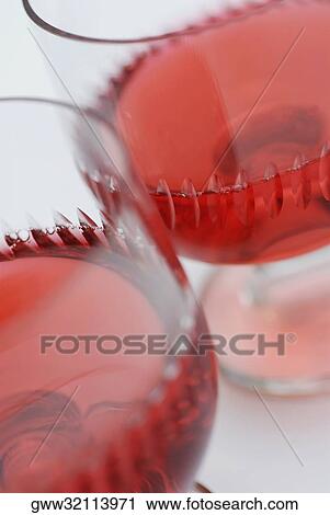 Close-up of red wine in glasses View Large Photo Image Stock Image - Close-up of red wine in glasses. Fotosearch