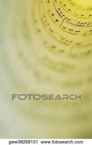 Stock Image - Close-up of rolled music sheets. Fotosearch