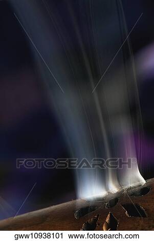 Close-up of smoke rising out of a wooden cylinder View Large Photo Image Stock Image - Close-up of smoke rising out of a wooden cylinder. Fotosearch