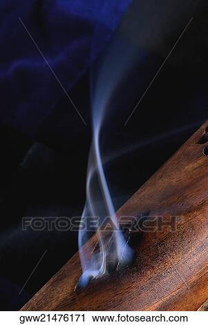 Close-up of smoke rising out of a wooden cylinder View Large Photo Image Stock Image - Close-up of smoke rising out of a wooden cylinder. Fotosearch