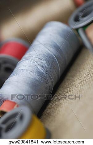 Stock Image - Close-up of spools of thread. Fotosearch