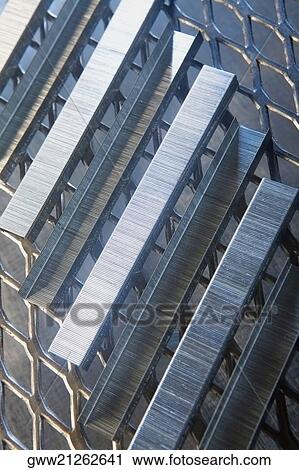 Close-up of staples on a metal grille View Large Photo Image Stock Image - Close-up of staples on a metal grille. Fotosearch