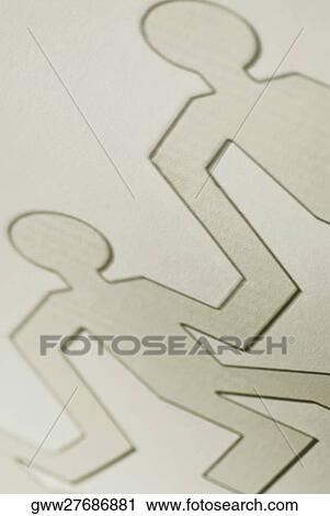 Close-up of the outline of paper chain dolls View Large Photo Image Stock Image - Close-up of the outline of paper chain dolls. Fotosearch