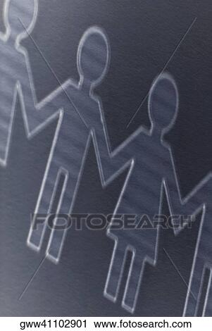 Close-up of the outline of paper chain dolls View Large Photo Image Stock Image - Close-up of the outline of paper chain dolls. Fotosearch