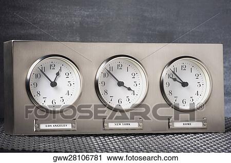 Stock Image - Close-up of three clocks. Fotosearch