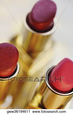 Close-up of three lipsticks View Large Photo Image Stock Image - Close-up of three lipsticks. Fotosearch