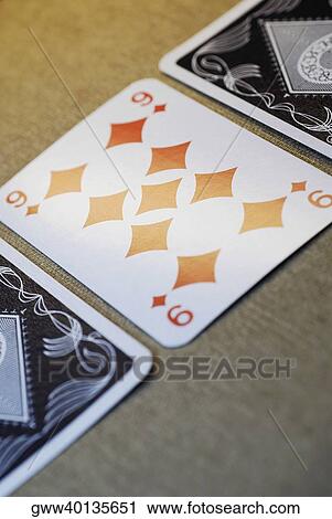 Stock Image - Close-up of three playing cards. Fotosearch