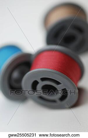 Close-up of three spools of thread View Large Photo Image Stock Image - Close-up of three spools of thread. Fotosearch